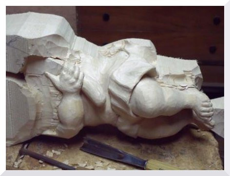 Talla en escultura d'un angelet del barroc.